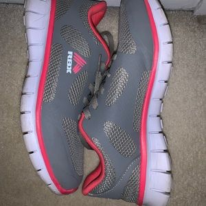 Grey and pink tennis shoes